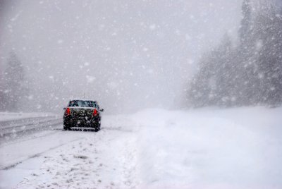 rear view of a car in a strong snowstorm