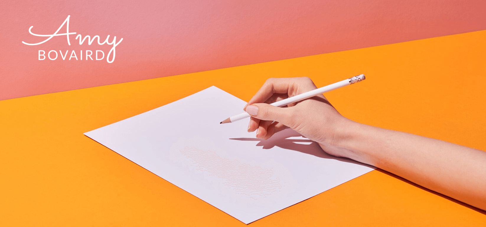 womans hand holding pencil to paper for an interview