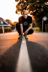 Morten Bonde squating down over a white line